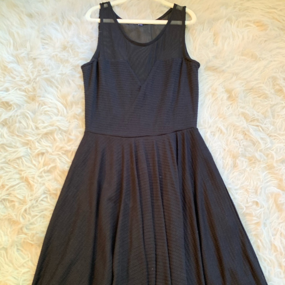 Black fit & flare dress with mesh neckline. Size medium. Brand is ocean drive.